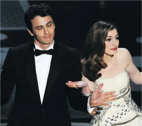  ?? GABRIEL BOUYS/GETTY IMAGES ?? Actors James Franco, left, and Anne Hathaway were roasted after hosting the Oscars together in 2011.