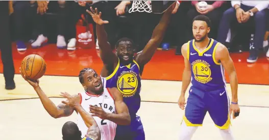  ?? GREGORY SHAMUS/GETTY IMAGES ?? Kawhi Leonard is a free agent this summer, but if he heeds the words of Draymond Green, middle, he’ll realize how important playing on a winning team is.