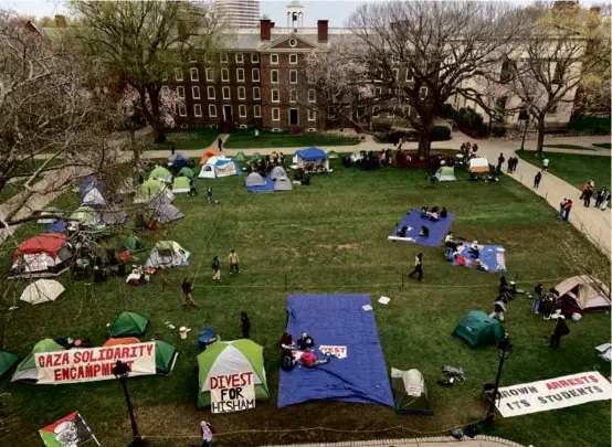  ?? SOFIA BURNETT FOR THE BOSTON GLOBE ?? Students created an encampment at Brown University on Wednesday, in solidarity with protesters at Columbia University.