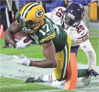  ?? MARK HOFFMAN / JOURNAL SENTINEL ?? Packers wide receiver Davante Adams finds the end zone, finishing off a 12-yard touchdown catch in the fourth quarter.