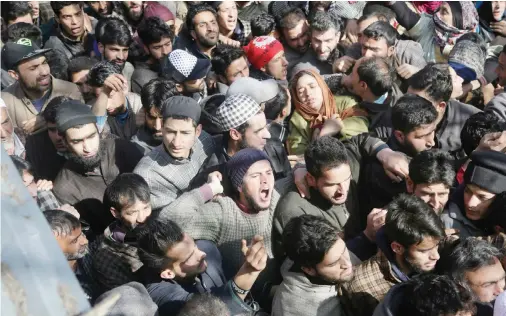  ??  ?? Kashmiri villagers shout slogans as they attend the funeral of civilian Suhail Ahmad at Pinjura village 52 kilometers south of Srinagar on Monday. (AP)