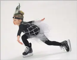  ??  ?? Six-year-old Ella Bendza prepares for her routine for this Sunday’s show during a rehearsal at June Levy Arena in Burrillvil­le Wednesday. Below: Olyvia Bendza rehearses her routine Wednesday on the ice.