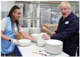  ?? ?? Lot on his plate: Mr Johnson at the Churchill China factory