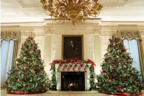  ?? The Associated Press ?? ■ The State Dining Room of the White House is decorated for the holiday season during a press preview of the White House holiday decoration­s on Monday in Washington.