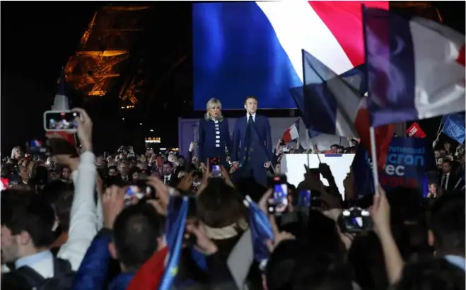  ?? ?? SECOND TERM: French incumbent President Emmanuel Macron and his wife Brigitte Macron attend a rally after the presidenti­al run-off in Paris, France, on April 24.