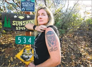  ?? Gary Kazanjian For The Times ?? THE FULL MEASURE of activist Beth Pratt’s dedication to the cause of mountain lion protection can be seen in her tattoo of P-22, the lone cougar prowling the chaparral-covered slopes in Griffith Park.