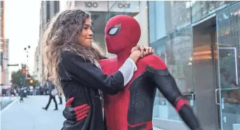  ?? JOJO WHILDEN ?? Michelle (Zendaya) catches a ride from Spider-Man in “Spider-Man: Far From Home.”