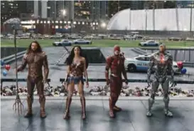  ??  ?? Jason Momoa, from left, Gal Gadot, Ezra Miller and Ray Fisher in a scene from “Justice League”.