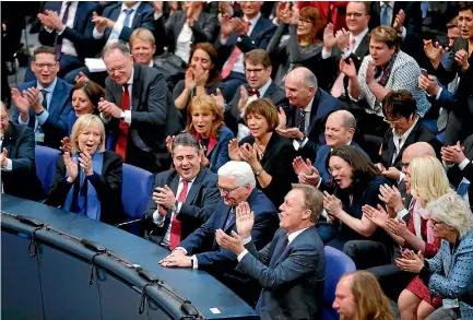  ?? PHOTOS: REUTERS ?? German president-elect, Frank-walter Steinmeier, receives applause after the first round of voting in the German presidenti­al election at the Reichstag in Berlin.