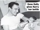  ??  ?? Gene Kelly gives Kerry her bottle