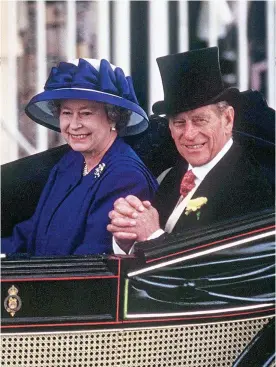  ??  ?? Role models: The Queen and Philip have been mother and father to he nation