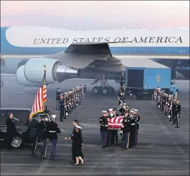  ?? Eric Gay Associated Press ?? A MILITARY honor guard carries President George H.W. Bush’s casket upon its arrival at Ellington Field in Houston after the services earlier in Washington.