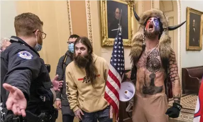  ?? Photograph: Manuel Balce Ceneta/AP ?? Jacob Chansley, right with fur hat, during the Capitol riot in Washington on 6 January.