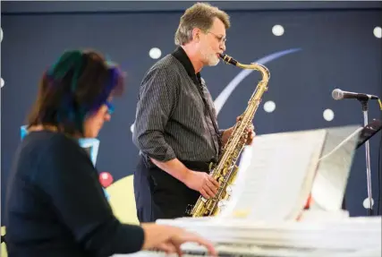  ?? Gazette file photo by Joshua Boucher ?? n Anna Walthall and Harvey Woods play "I'll Be Home for Christmas" at Central Mall last Christmas season with their band, The Team at Living Waters Church. The live music series at the mall continues this year with two more weekends of free, live...