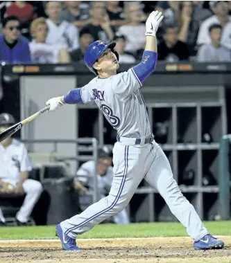  ?? JONATHAN DANIEL/GETTY IMAGES ?? Toronto Blue Jays’ batter Darwin Barney hits a three-run double in the 6th inning against the Chicago White Sox, at Guaranteed Rate Field on Monday in Chicago.