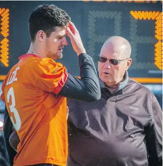  ?? RIC ERNST/ POSTMEDIA NEWS ?? B. C.’ s Richie Leone, left, chats with kicking consultant Don Sweet, right during the team’s practice at their facility in Surrey Tuesday. Leone botched two more converts ( he’s missed 11 on the season) in last Friday’s 27- 25 win over the Toronto...