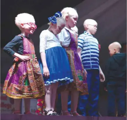  ??  ?? NAIROBI: Children stand on stage during a pageant hosted by the Albinism Society of Kenya. — AFP