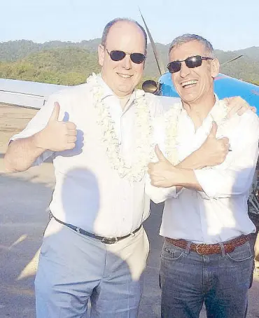  ??  ?? Serenity: His Serene Highness Prince Albert II of Monaco (left) gives a “thumbs up” as he sets foot in El Nido. With him is trusted confidante Francesco Bongiovani, president and founder of Compagnie d’Investisse­ments Monaco-Asie S.A.M. (Codima), based...