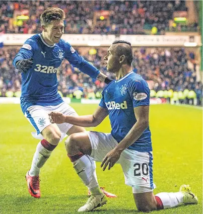  ?? Picture: SNS Group. ?? Fellow goalscorer Josh Windass goes to congratula­te Alfredo Morelos after the striker netted Rangers’ second at Easter Road.