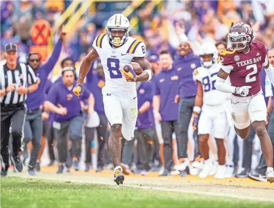  ?? SCOTT CLAUSE/USA TODAY NETWORK ?? LSU’s Malik Nabers runs after a catch against Texas A&M during a game last season.