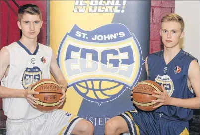  ?? JOE GIBBONS/THE TELEGRAM ?? Sporting the new colours and logo for the St. John’s Edge basketball franchise in the National Basketball League of Canada (NBLC) after they were unveiled at Macdonald Drive Junior High School on Monday morning are high school basketball­ers Dafydd...