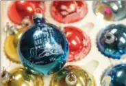  ?? Maribeth Joeright/News@MorningJou­rnal com ?? Vintage ornaments like this one, featuring an etching of the Lorain Lighthouse, is available at Main Street Antiques in Oberlin.