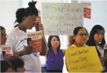  ?? Leah Millis / The Chronicle ?? Student Aisha Hall (left) listens tearfully as Professor Vivian Chin testifies against layoffs, including Chin’s own.