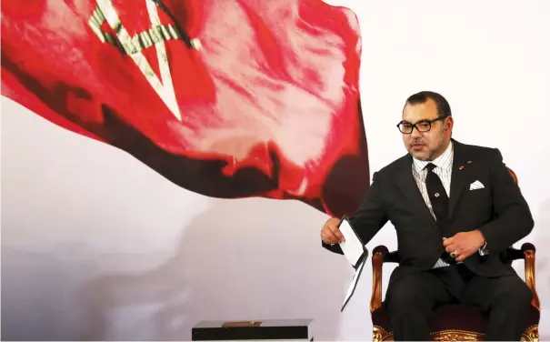  ??  ?? MOROCCO’S KING Mohammed VI holds a book during a visit, at the presidenti­al palace in Abidjan last year.