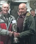  ??  ?? Most points overall in the three stock judgings and winner of the Gartivaigh Cup Andrew Reid and judge Willie McLean.