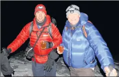  ??  ?? Detective superinten­dent Neil Castle at Leicesters­hire Police and assistant chief constable at Nottingham­shire, Stu Prior, climbed Mount Kilimanjar­o for charity.