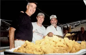  ?? Democrat-Gazette file photo ?? John Bennett (from left), Gary Parrish and Ed Staley, here at the 2000 Camp Aldersgate fish fry fundraiser, take their fried fish very seriously. “You think your fish is better than Grampa’s?” I asked Bennett. “You better believe it,” he said. Yo,...