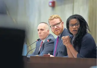  ??  ?? GOOD LISTENERS: Boston City Councilors Ed Flynn, left, Matt O’Malley and Lydia Edwards listen to the speakers at yesterday’s council hearing.