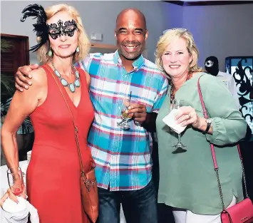 ??  ?? From left: Brenda Christofor­atos with Tyrone Aguillard and Jaci Bennett.