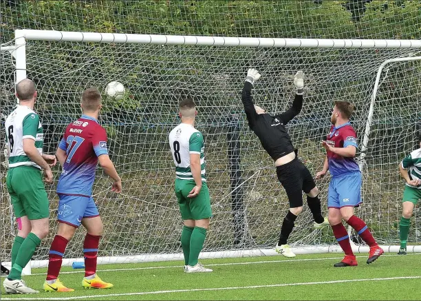  ?? Pictures: Larry McQuillan ?? Mark Doyle (hidden) plants the ball in the net to put Drogheda United 4-0 ahead against Evergreen.