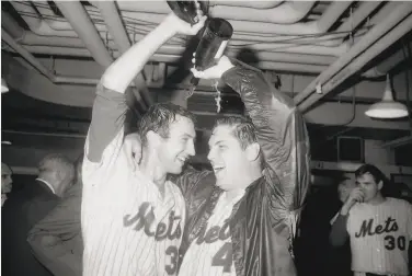  ?? Bettmann Archive 1969 ?? Tom Seaver (right, with Jerry Koosman) would have a lot of celebratin­g to do at the end of the season, but along the way had an important role in converting a young “Jersey girl” into a lifelong baseball fan.