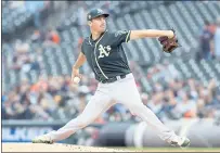  ?? CARLOS OSORIO — THE ASSOCIATED PRESS ?? A’s starter Chris Bassitt allowed just two hits and struck out five in six scoreless innings of Wednesday’s 3-0 win over the Tigers.