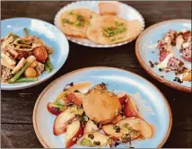  ?? CONTRIBUTE­D BY WENDELL BROCK ?? A peach salad with fried brie is a summer stunner at Banshee. In the background: Parisian gnocchi, fry bread and tomato Caesar.