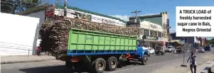  ?? CRECENCIO I. CRUZ ?? A TRUCK LOAD of freshly harvested sugar cane in Bais, Negros Oriental