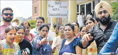  ?? HT FILE ?? Parents gather outside Ryan Internatio­nal School at Mayur Vihar Phase III after the brutal murder of a student of Ryan Gurgaon.