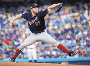  ?? AP FILE ?? Washington pitcher Stephen Strasburg is returning to the Nationals after agreeing to a seven-year, $245 million contract according to a source.