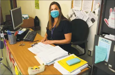  ?? Erik Trautmann / Hearst Connecticu­t Media ?? Naramake Elementary School Nurse Nicole O’Brien working in the building on Thursday, in Norwalk. School nurses’ duties are shifting in light of the pandemic.