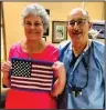  ?? Submitted photo ?? PRESENTATI­ON: Dr. Stuart Fleischner, right, with Arkansas State Society Colonial Dames of the 17th Century State President Linda Vandenberg White, who is displaying one of the Braille flags.