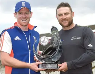  ??  ?? WHO WILL TAKE THE TROPHY? England captain Eoin Morgan, left, and New Zealand captain Brendon McCullum pose with the one-day series trophy at Edgbaston in Birmingham.