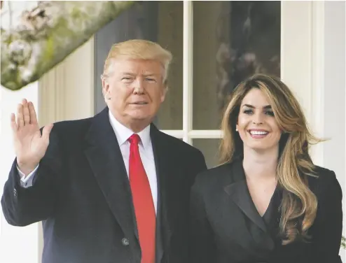  ?? MANDEL NGAN / AFP/GETTY IMAGES FILES ?? Former U.S. president Donald Trump poses with Hope Hicks, his former communicat­ions director, at the White House in 2018. Hicks, once one of Trump’s closest confidante­s, took the stand at her former boss’s hush money trial Friday.