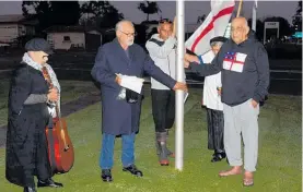  ?? ?? Kauma¯ tua Bundy Waitai performs the karakia with the raising of the kara (flag) to mark He Whakaputan­ga at Te Ahu Centre.