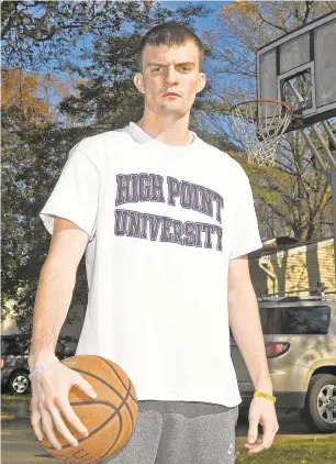  ?? PAULW. GILLESPIE/CAPITAL GAZETTE ?? Southern senior Jake Koverman suffered a severe knee injury that took away basketball, and soon after his mother was diagnosed with Lymphoma. Koverman earlier this month signed his National Letter of Intent to play Division I basketball at High Point University.