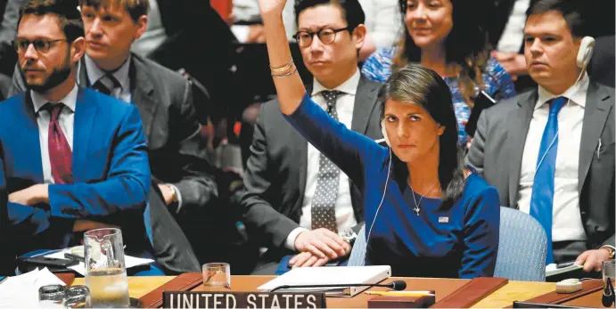  ??  ?? US ambassador to the UN Nikki Haley vetoes a Russian proposed draft resolution to condemn US aggression against Syria during a Security Council emergency meeting last Saturday.