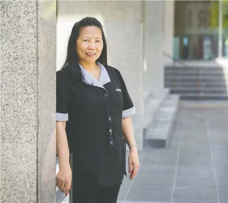  ?? ARLEN REDEKOP ?? The ability of janitors and cleaners like Loida Aubay to clean and sanitize office towers and malls will help people feel safe to return as lockdown restrictio­ns ease. Aubay supports her union’s push for a $2-an-hour raise, improved job security and access to protective masks and gloves.