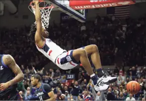  ?? Stew Milne / Associated Press ?? UConn’s Isaiah Whaley dunks the ball during the first half against DePaul on Saturday.