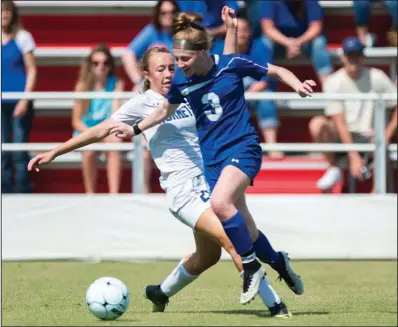  ?? NWA Democrat-Gazette/CHARLIE KAIJO ?? Rogers midfielder Skylurr Patrick (3) and Bryant’s Abbey Inman (21) fight for possession of the ball during the Class 7A girls state soccer championsh­ip Friday at Razorback Field in Fayettevil­le. Patrick had all three goals for Rogers as it won 3-2 in overtime.